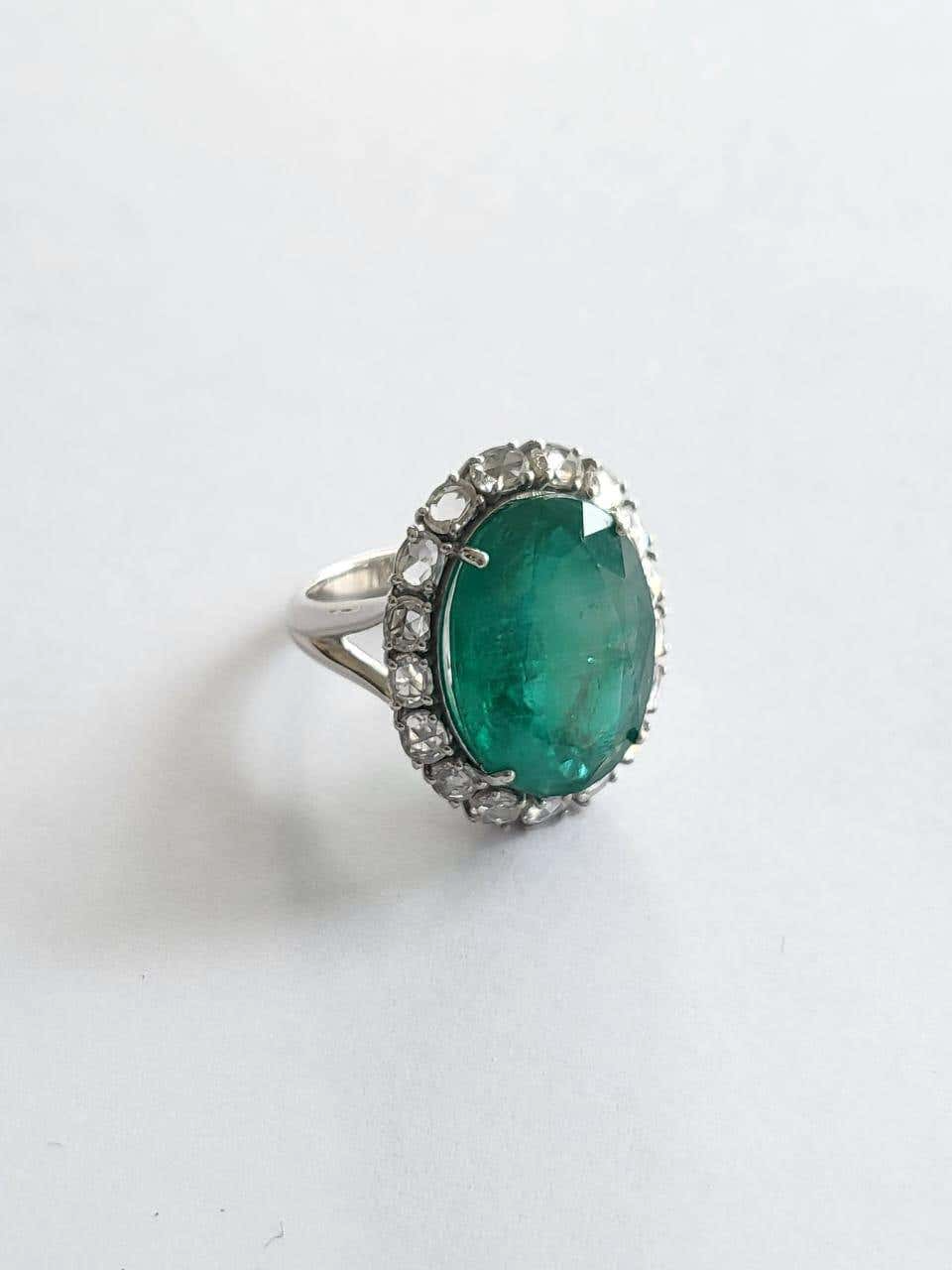 diamond engagement ring with emerald